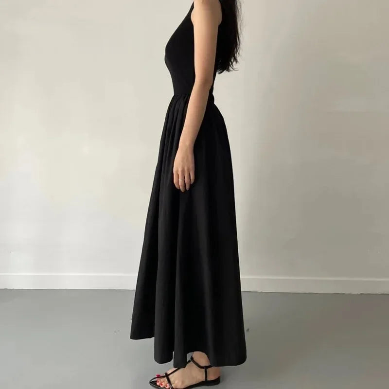 Elegant Black Sleeveless Maxi Dress with Flowing Skirt