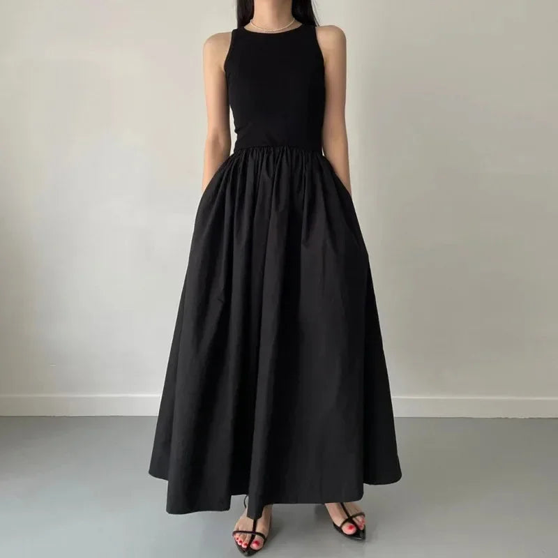 Elegant Black Sleeveless Maxi Dress with Flowing Skirt