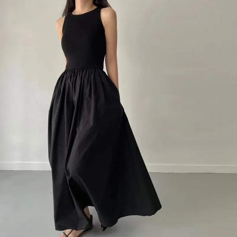 Elegant Black Sleeveless Maxi Dress with Flowing Skirt