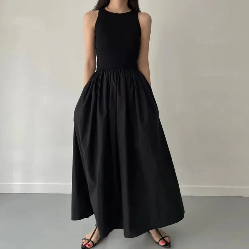 Elegant Black Sleeveless Maxi Dress with Flowing Skirt