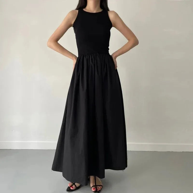 Elegant Black Sleeveless Maxi Dress with Flowing Skirt