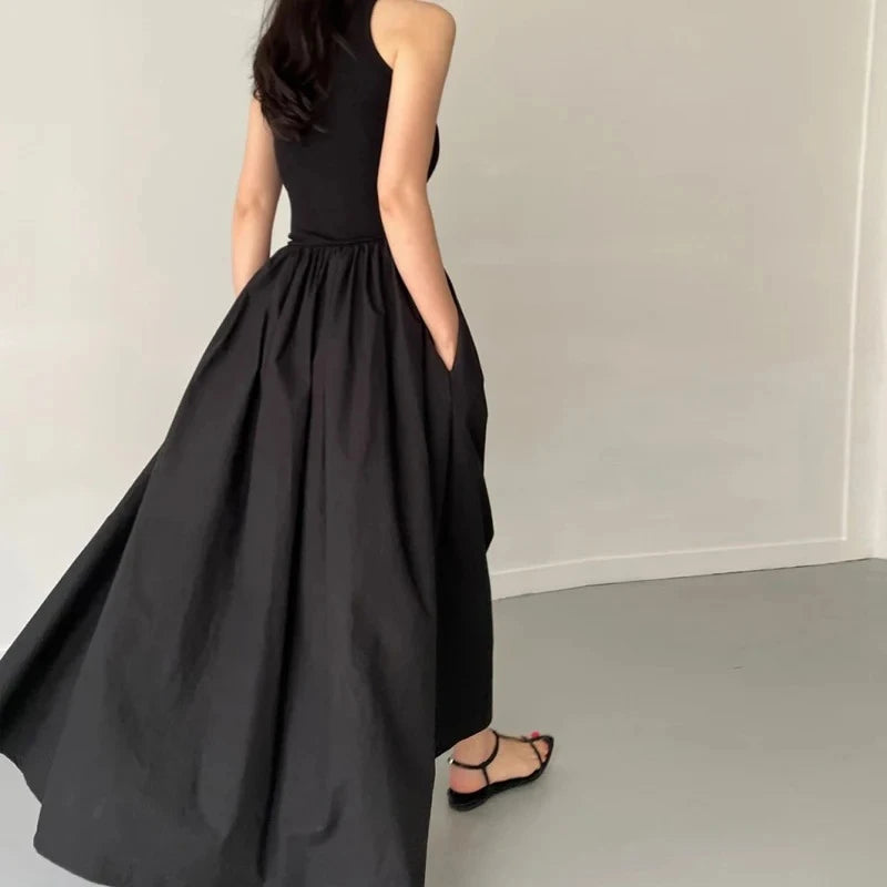 Elegant Black Sleeveless Maxi Dress with Flowing Skirt